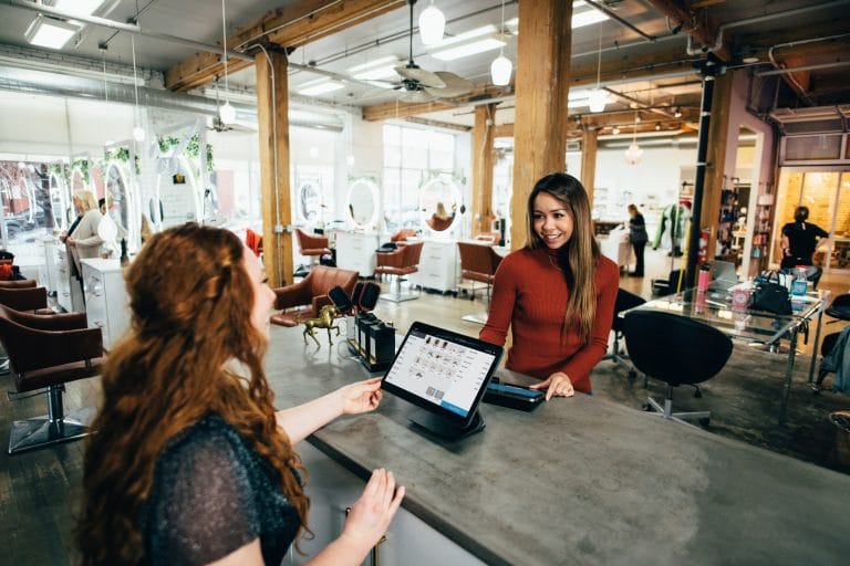 two women sat at desk