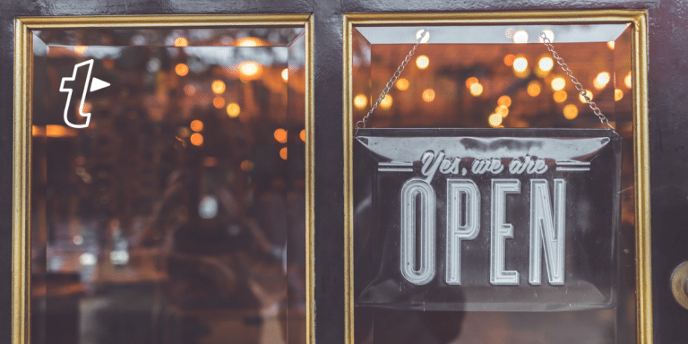 a shop window with an open sign