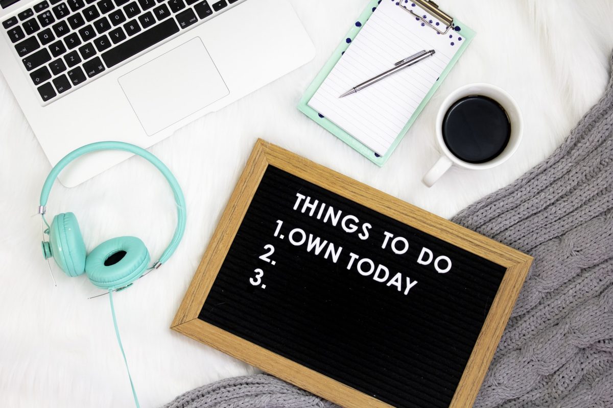 a desk with a to-do list that says 'own today'