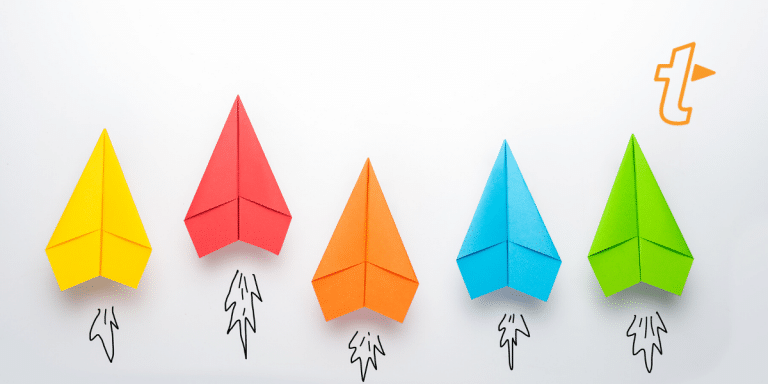 Five colourful paper airplanes with drawn rocket trails launching upward, with the TextExpander logo
