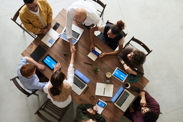 Recruiting team meeting seen from above