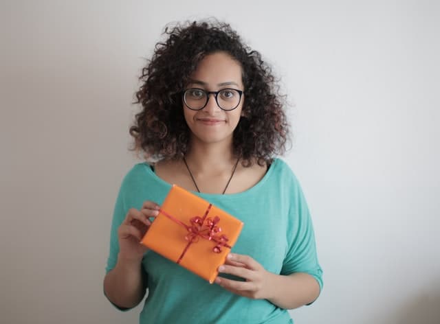 Female recruiter holding a gift.