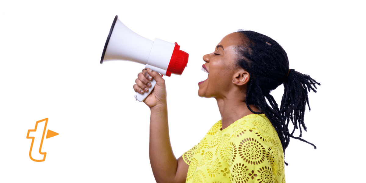 Woman in a yellow top shouting into a megaphone, with the TextExpander logo