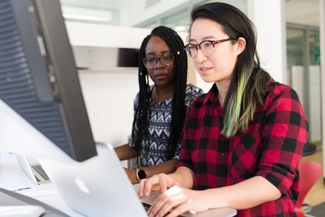 Women of different races working together.