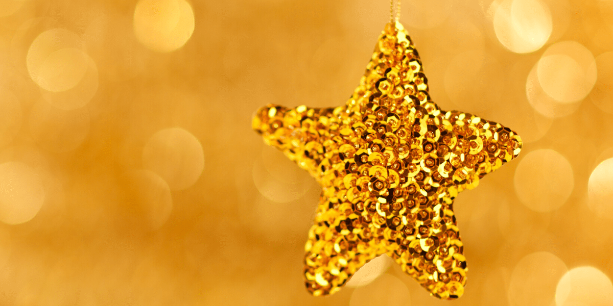 gold star with blurry background 