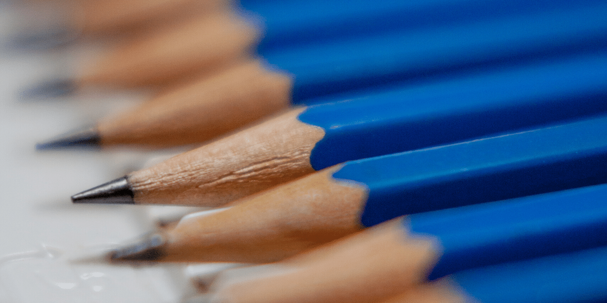 Sharpened blue pencils in a row 