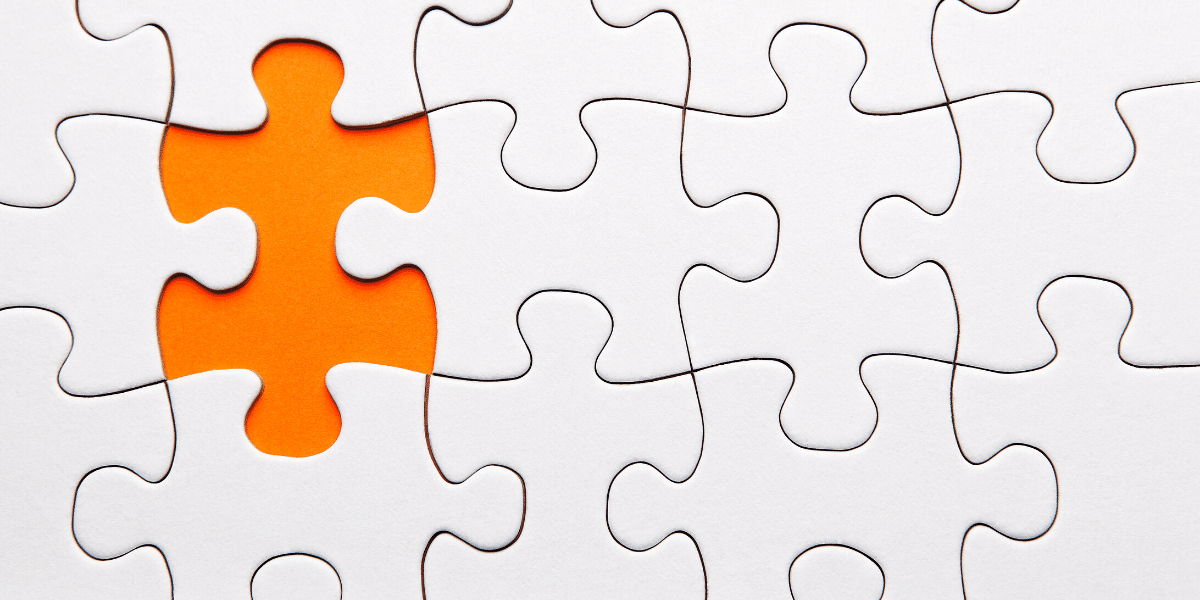 A missing puzzle piece with an orange background