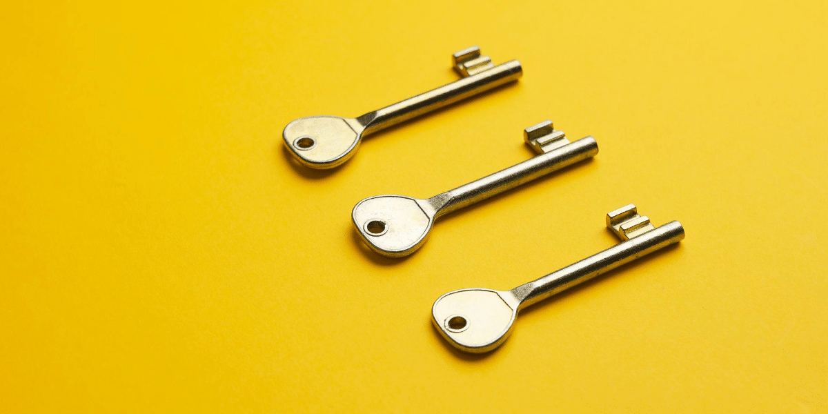 three keys on a yellow background