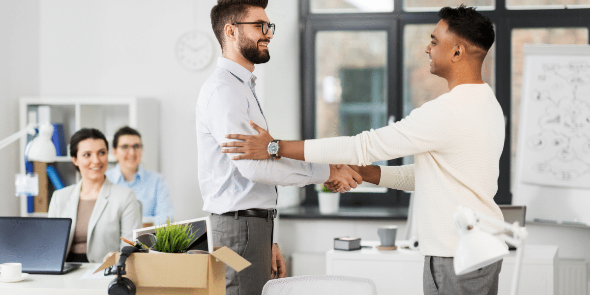 2 males shaking hands