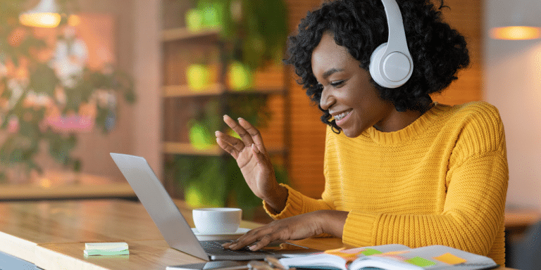remote working woman waving