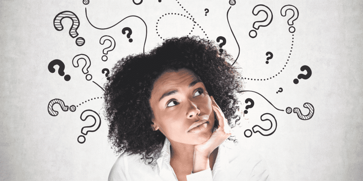 woman thinking with question marks around her