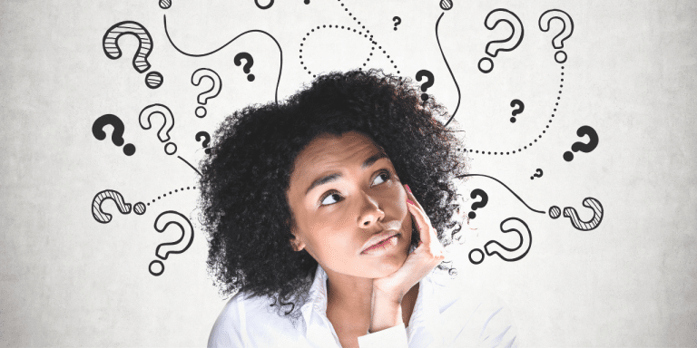 woman thinking with question marks around her