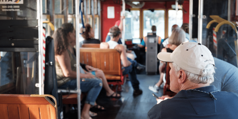 Passengers riding a New Orleans streetcar, representing different customer groups