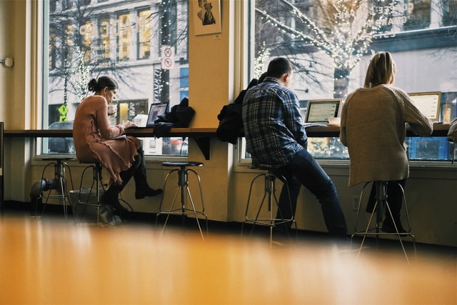 Remote employees work from a coffeeshop