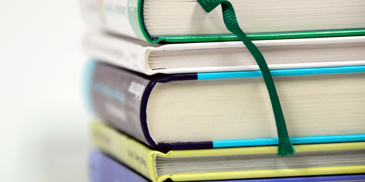 a stack of large research books