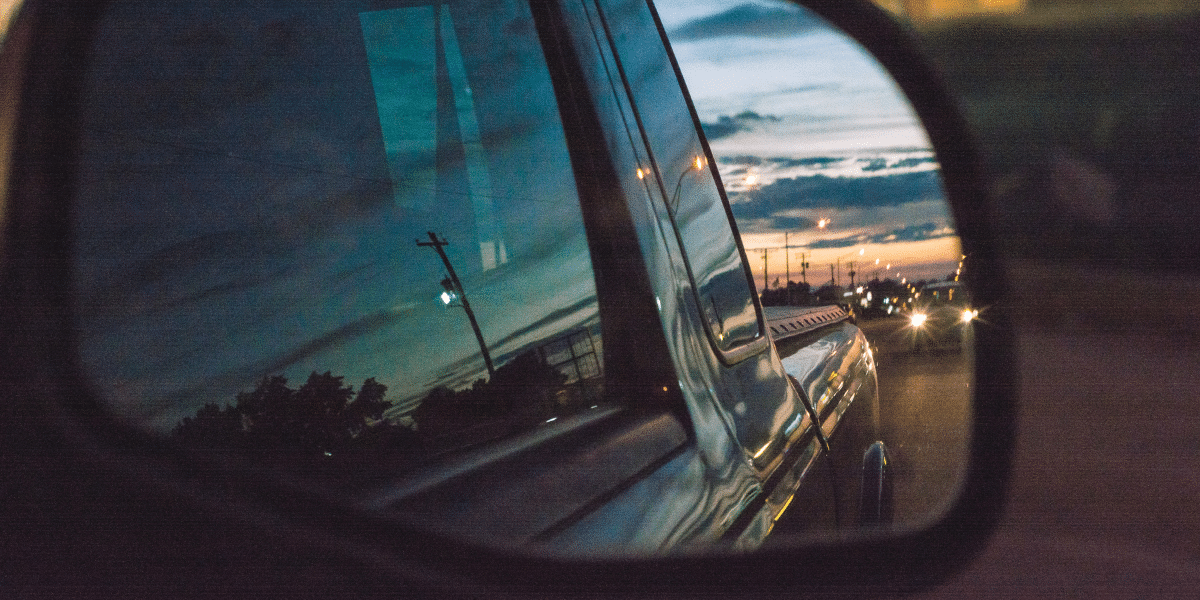 car mirror with city reflection