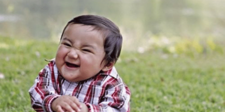 Smirking toddler in a plaid shirt, known as the Evil Kid meme, for a post on customer service memes