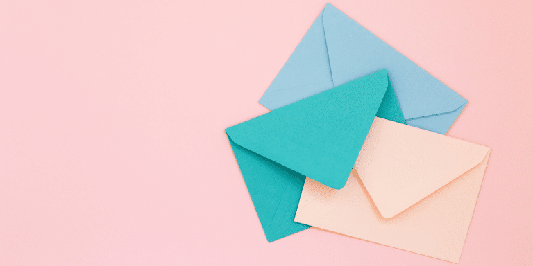 3 envelopes on pink background