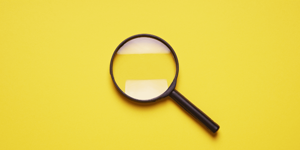 magnifying glass on yellow background