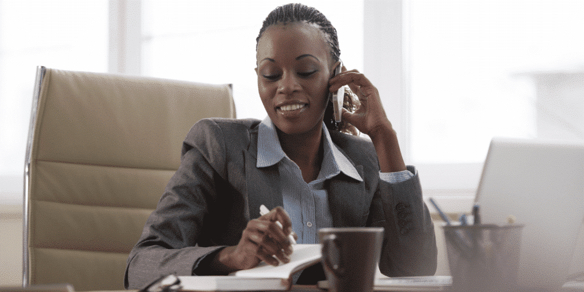 woman on the phone at her desk
