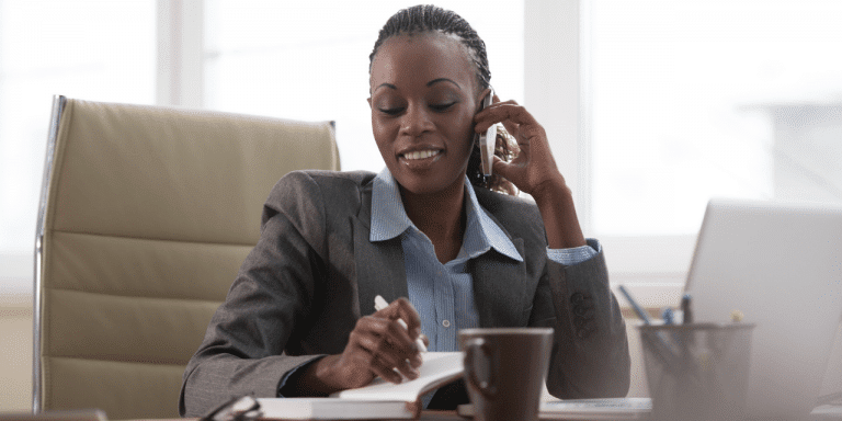 woman on the phone at her desk