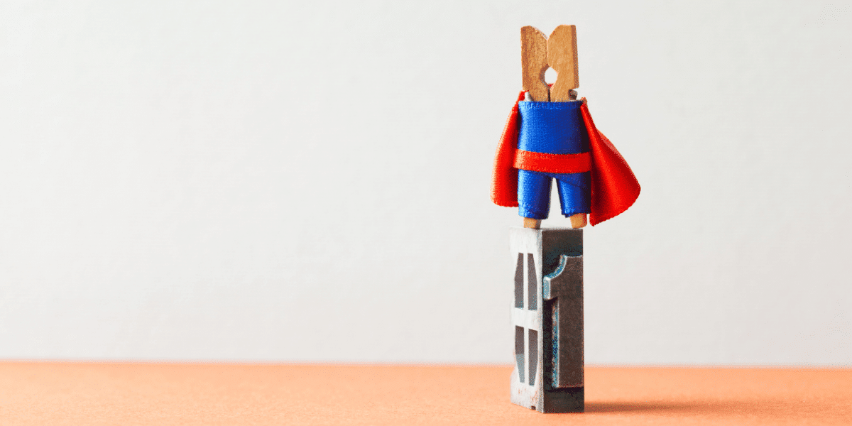 small peg wearing a super hero costume