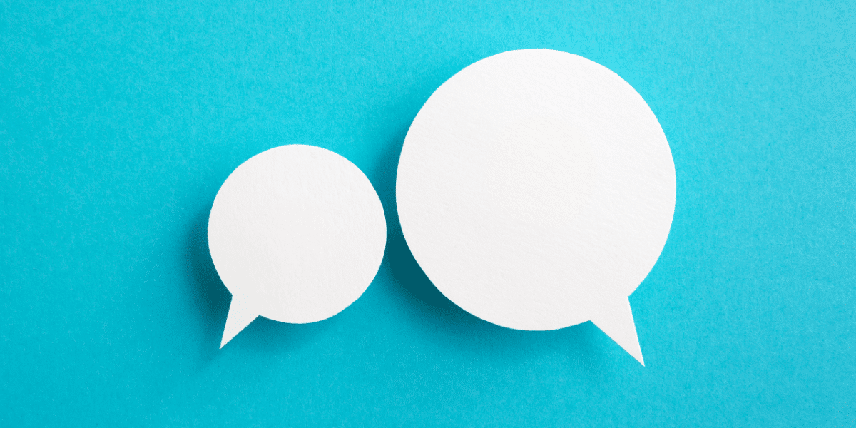 Two white speech bubbles on a bright blue background