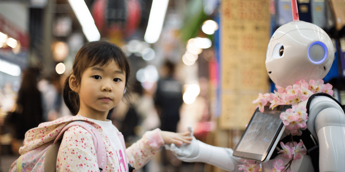 Little girl touches robot to represent recruitment technology balanced with a human touch