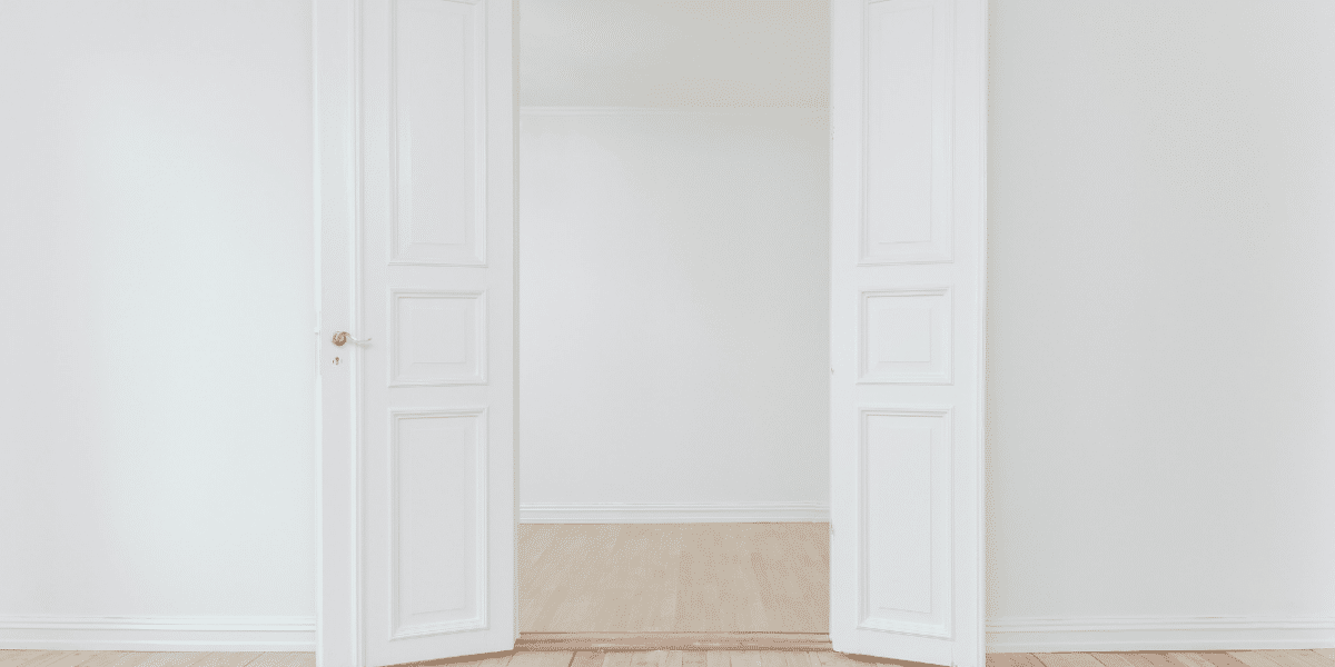 Two white doors wide open representing access to the workplace