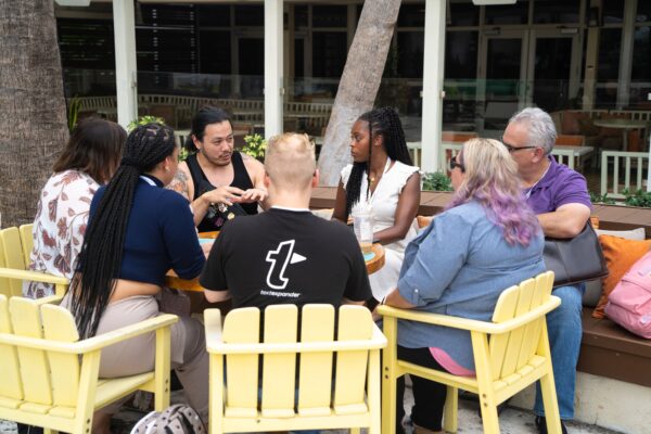 A group of TextExpander employees gathers in a circle.