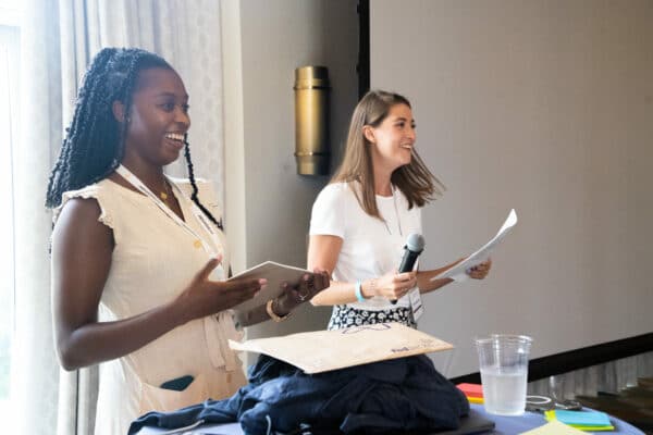 Two TextExpander employees present an awards ceremony during the retreat.