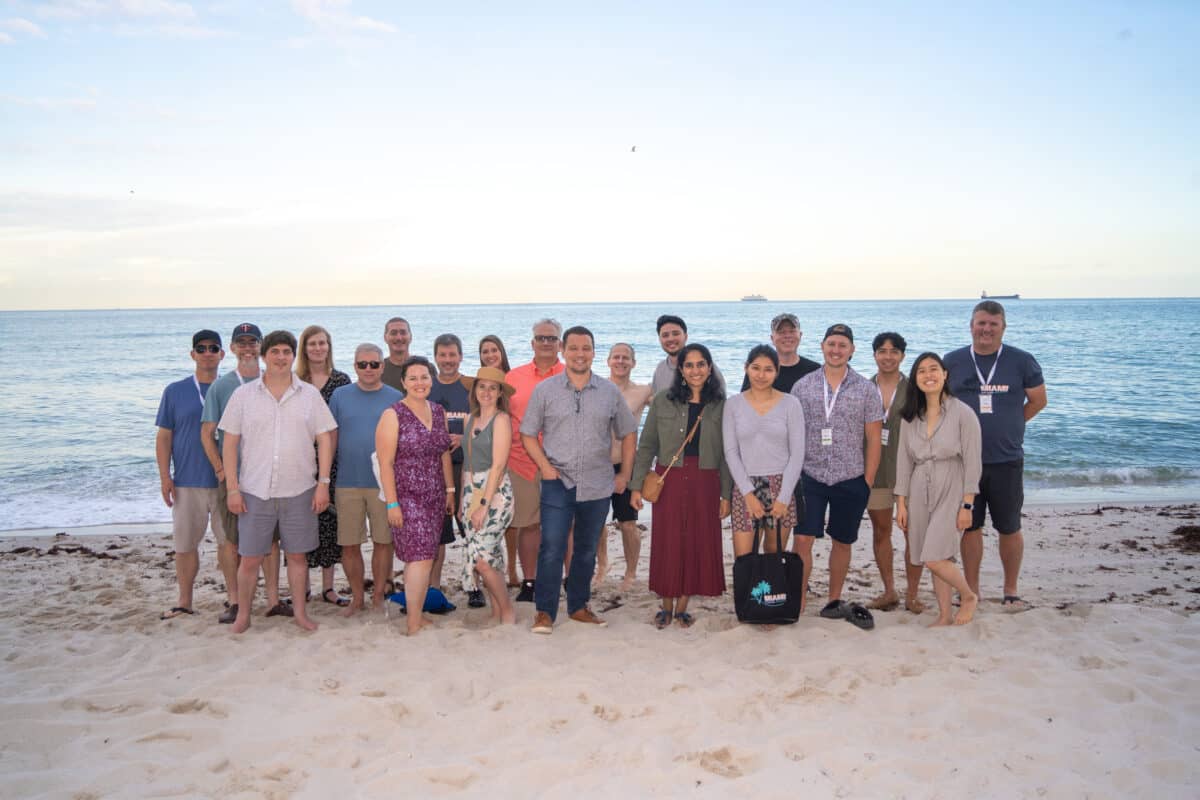 The TextExpander team poses for a picture on the beach during the retreat.