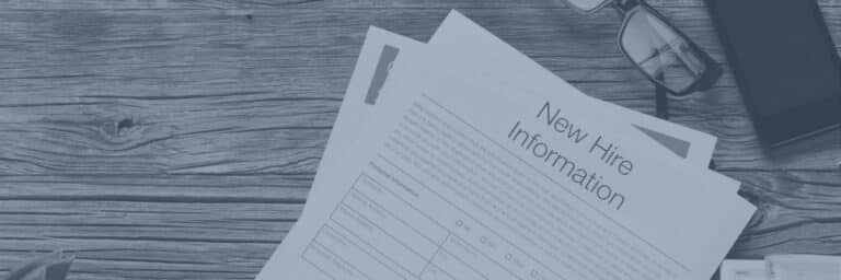 New Hire Information form on a wooden desk beside glasses and a phone, in a blue-tinted banner