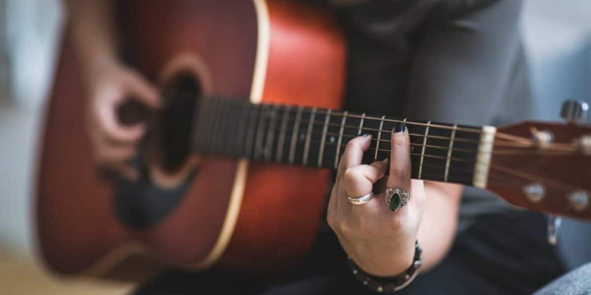 Orchestra candidate plays guitar for skills-based hiring