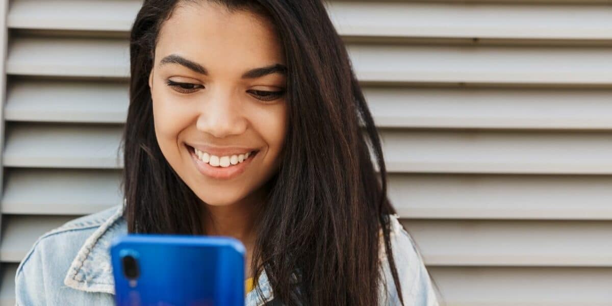 Woman with smartphone use TextExpander