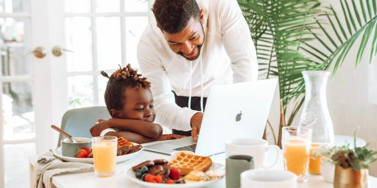 Father and child at laptop